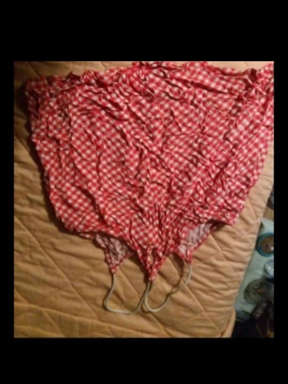A Red Spaghetti Strap Top W/ Flowers
